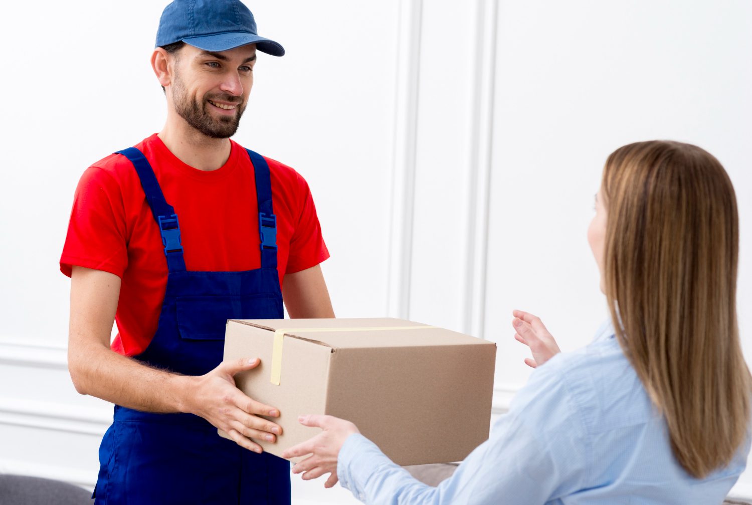 courier man delivering cardboard box woman